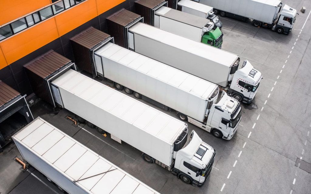 aerial-view-of-trucks-loading-in-the-distribution-hub-1