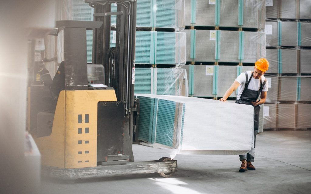 young-man-working-at-a-warehouse-with-boxes-1